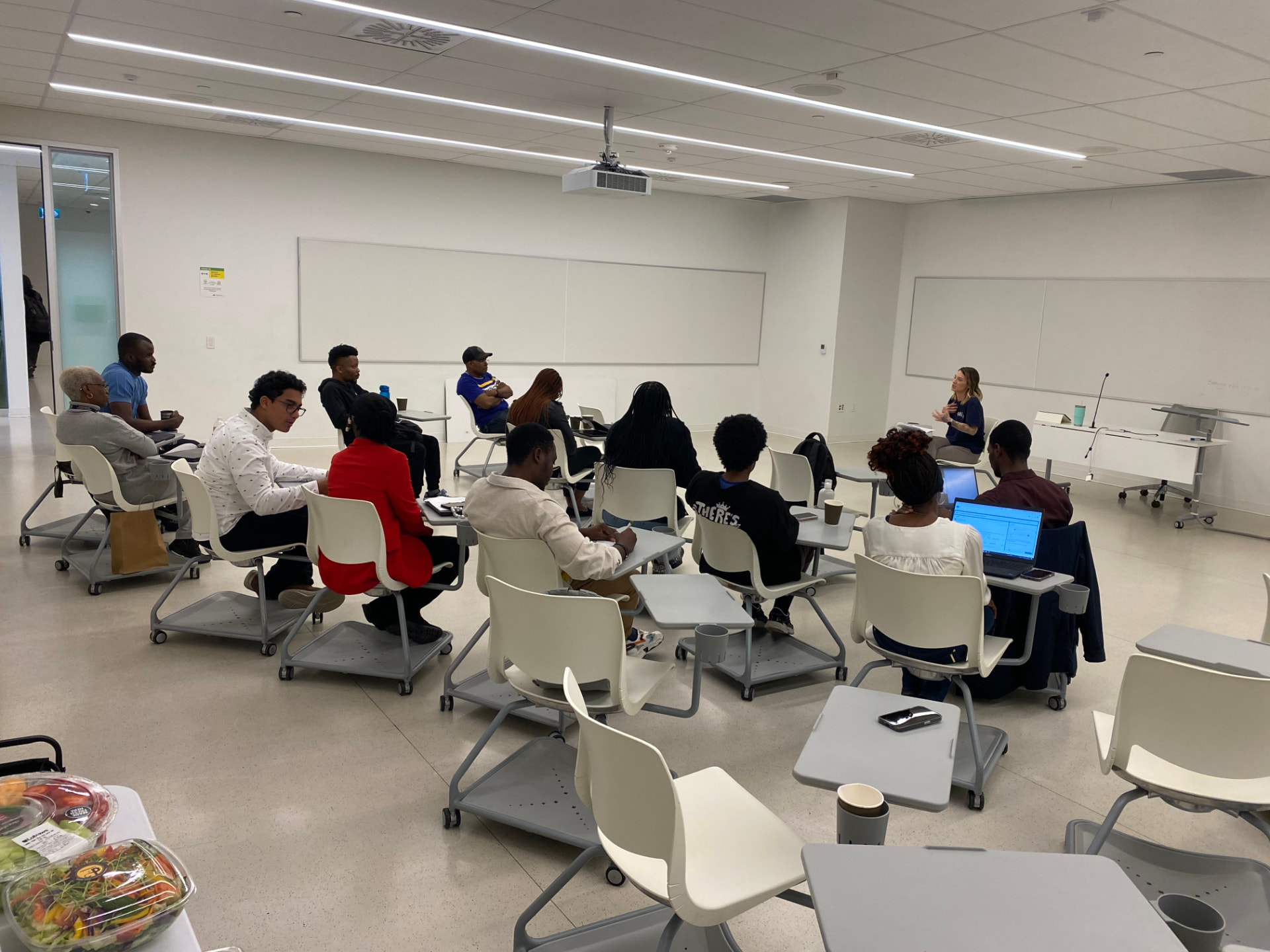 A manager with her team — capacity is built in real work